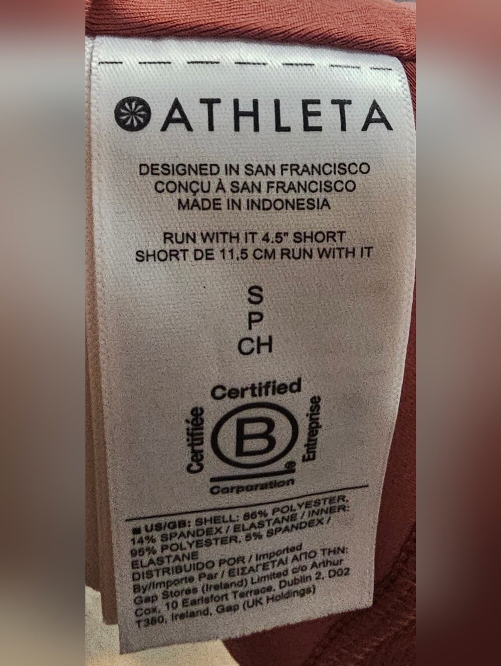 Athleta running shorts coral color feature a wide waistband and a side tag. Smal - Picture 6 of 8